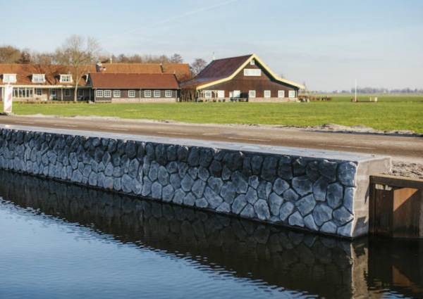 Kademuren met traditionele basalt in (prefab) beton